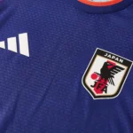 Ensemble d’entraînement Japon bleu et rouge · Adulte — Écusson et matière